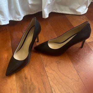 Black leather coach heels